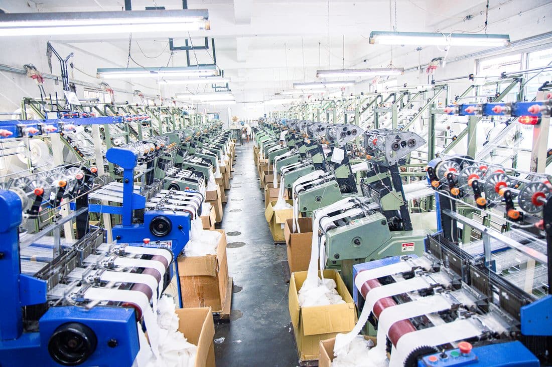 Sunway manufacturing floor — narrow-fabric weaving looms